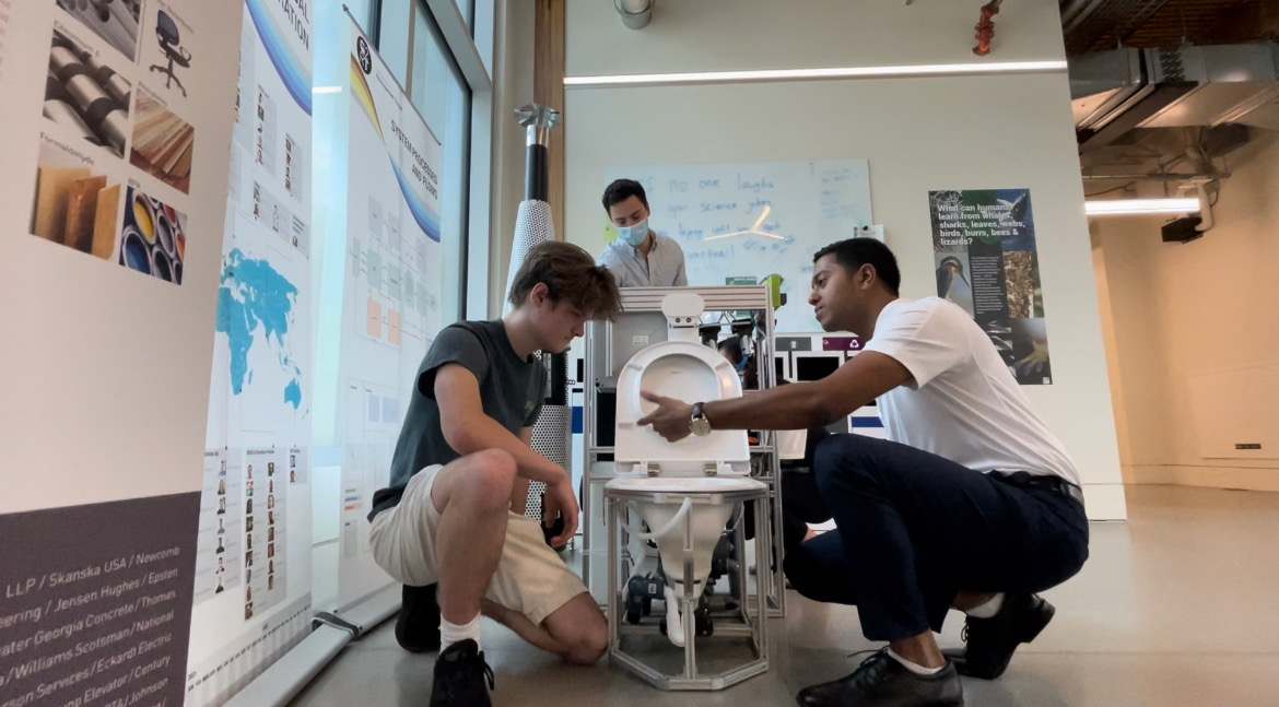 Students servicing toilet. 